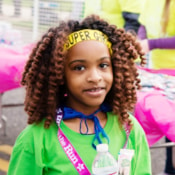 A Girls on the Run participant smiling at the 5k finish.